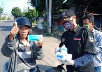 Forkoci Bagikan 25 Ribu Masker Gratis Kepada Pengendara