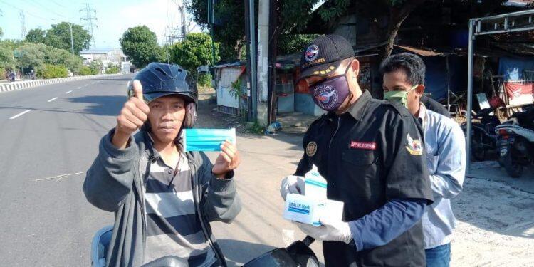 Forkoci Bagikan 25 Ribu Masker Gratis Kepada Pengendara