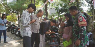 Babinsa dan Bhabinkamtibmas Sukapura Bersinergi Amankan Penyaluran Kartu ATM PKH dan Sembako 2025
